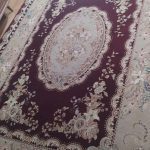 فرش زیبای زمینه زرشکی